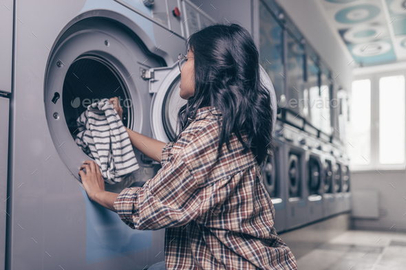 Attractive girl by the washing machine Stock Photo by AboutImages | PhotoDune