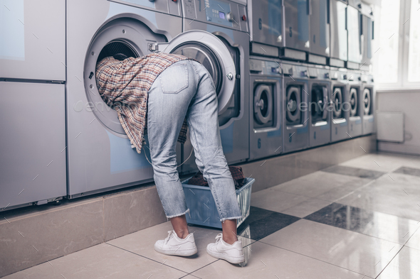 Female feet in the washing machine Stock Photo by AboutImages | PhotoDune