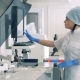 Female Lab Expert Is Managing Automatic Pharmaceutical Equipment - VideoHive Item for Sale