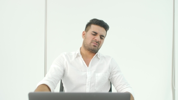 Business Man Getting Very Bad News on His Laptop