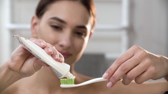 Teeth Hygiene. Woman Applying Toothpaste On Toothbrush, Stock Footage