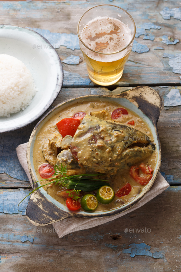 Curry fish head, Traditional singaporean cuisine Stock Photo by fazeful