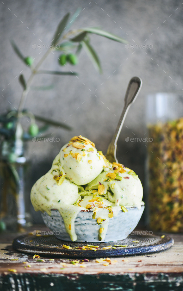 Bowl of pistachio ice cream on kitchen counter, close-up - Stock Photo - Images