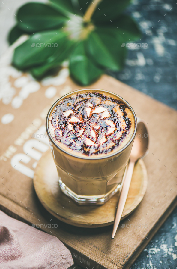 Classic Latte coffee with chocolate sauce pattern in glass Stock Photo by sonyakamoz