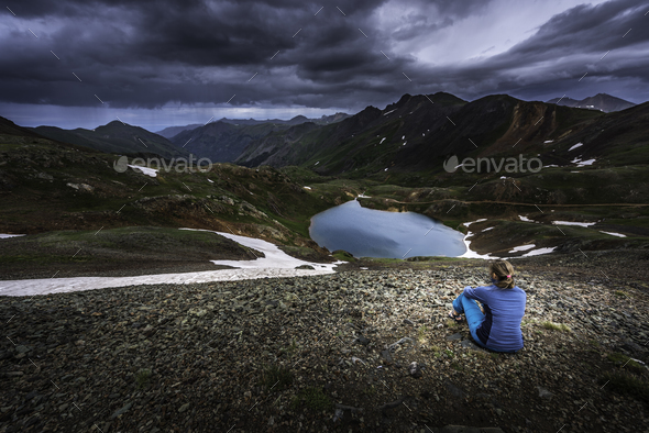 Tourist admires view from Hurricane Pass towards lake Como and P - Stock Photo - Images