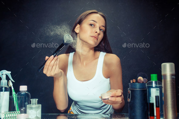 Beauty woman applying makeup - Stock Photo - Images