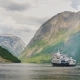 A Small Cruise Ship with Tourists Begins a Trip To the Fjord in Norway - VideoHive Item for Sale