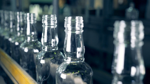 Washed Bottles Go on an Assembly Line alt