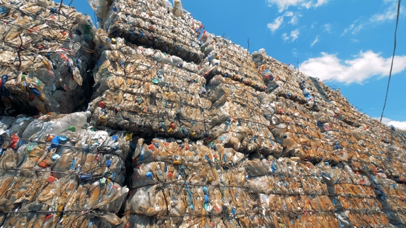 Plenty Stacked Trash Blocks with Plastic Ready for Further Recycling alt
