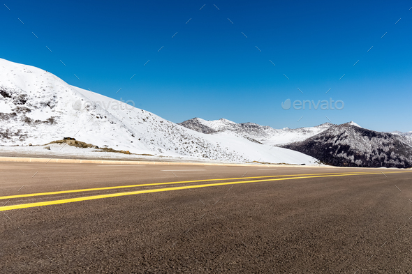 highway and snow mountain in tibet plateau Stock Photo by chuyu2014