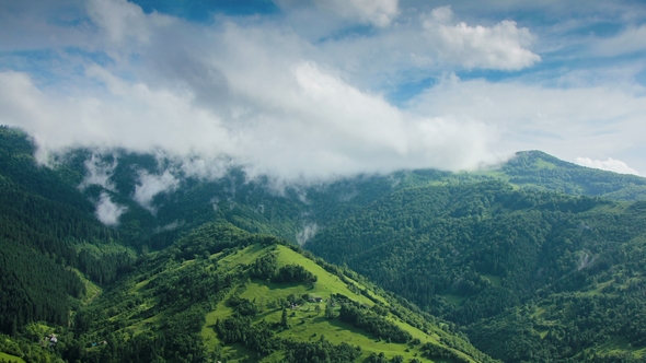 Timelapsed Scenery with Mountain Peaks and Cloudy Sky alt