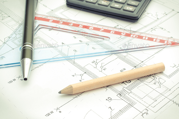 Drawing accesories and calculator on housing plan, building home cost concept Stock Photo by ratmaner