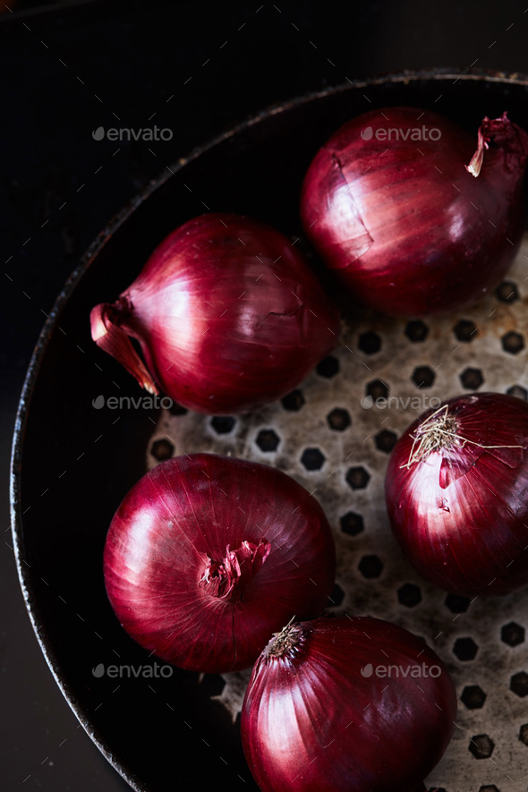 Sliced red spanish onion on vintage frying pan Stock Photo by lenina11only