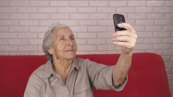 Mature Woman with a Phone alt