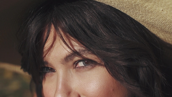 Mysterious and Attractive Look of a Young Girl Who Looks at the Camera