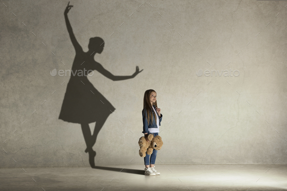 Baby girl dreaming a dancing ballet on the stage. Childhood concept. - Stock Photo - Images