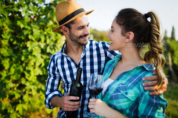Wine growers tasting wine in vineyard Stock Photo by nd3000 | PhotoDune