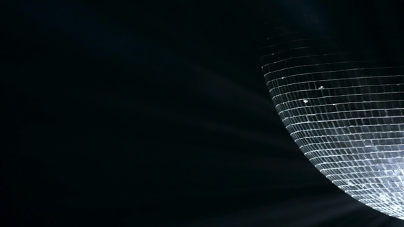 Mirror Ball, Also Known As a Disco Ball, Spinning Against Black alt