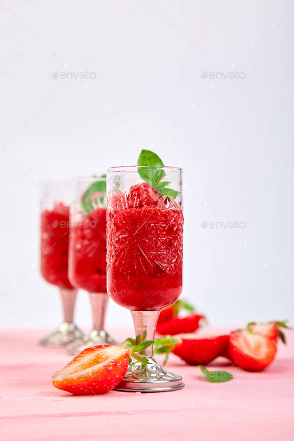 Summer refreshing strawberry sorbet, slush granita drink Stock Photo by bondarillia