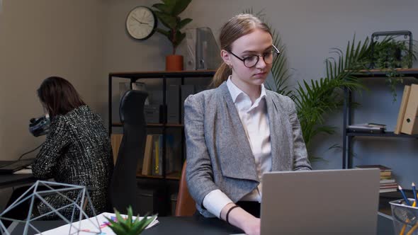Young Business Woman Freelancer Concentrated Developing New Project While Looking on Laptop Screen alt