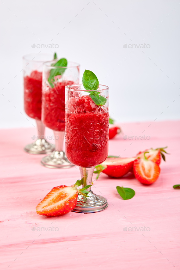 Summer refreshing strawberry sorbet, slush granita drink Stock Photo by bondarillia