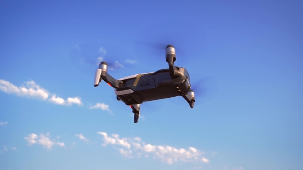 Quadrocopter Flies in Place Against the Background of the Sea UAV in