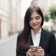 Young Beautiful Business Woman Using Smartphone and Walking on the Old Street - VideoHive Item for Sale