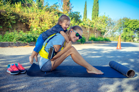 Sportive mother with child outdoors Stock Photo by Anna_Om | PhotoDune