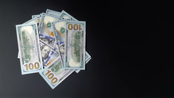 Money Turns On A Black Background By Sibcam Videohive
