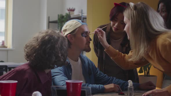 A Young Lady is Drawing Her Friend a Greasepaint alt