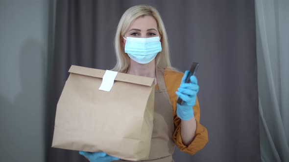 Health Protection Safety and Pandemic Concept  Delivery Woman in Face Protective Mask and Gloves alt