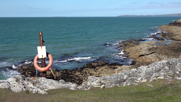 Rotten Lifebuoy at the Rocky Coastal Landscape Taken in Holyhead alt