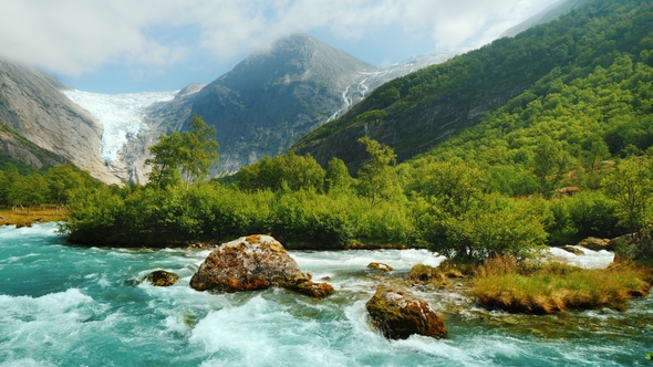 Briksdal Glacier with a Mountain River in the Foreground. The Amazing Nature of Norway alt