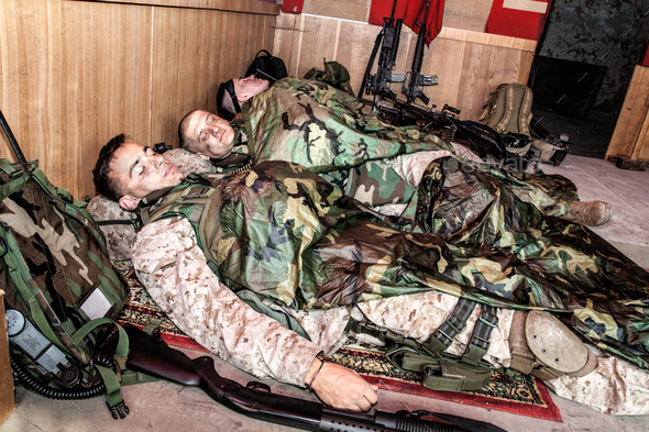 Tired soldiers sleeping on floor at temporary base Stock Photo by Getmilitaryphotos