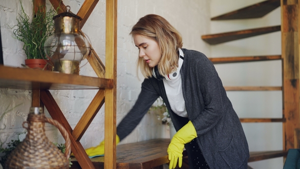 Professional Housekeeper Is Dusting Furniture with Wet Cloth alt
