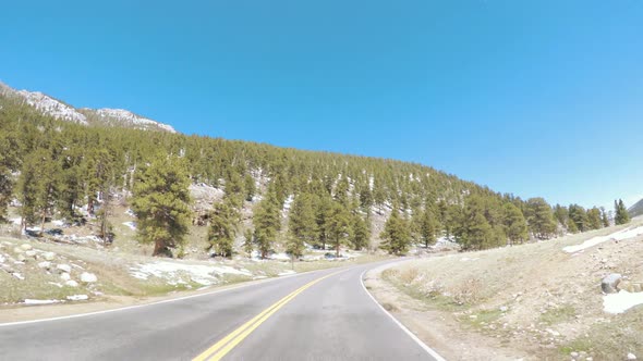 POV point of view -Driving through Rocky Mountain National Park in the Spring. alt