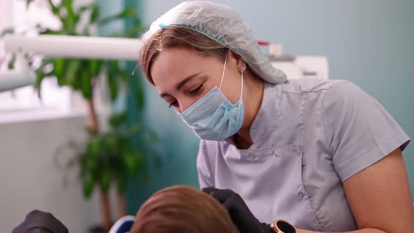 Two Woman Doctors in a Dental Clinic Serve the Patient Little Boy alt