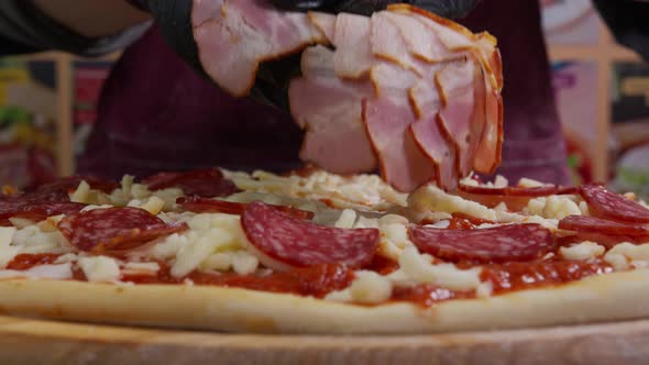 Close Up View of a Man Chef Cooking Italian Pizza. The Process of Making Pizza at Table . Fresh alt