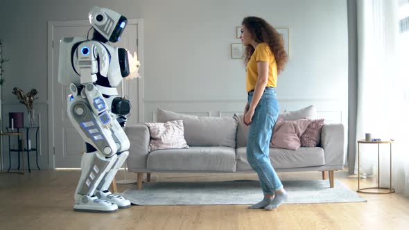 Human-like Cyborg and the Lady Are Touching Hands. Smart Home Concept alt