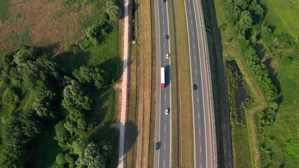 Aerial Vertical Shot. Cars Driving By the Road. Traffic on the Highway alt