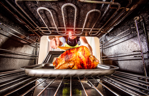 Cooking chicken in the oven at home. Stock Photo by cookelma | PhotoDune