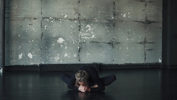 Young Man Practicing Yoga Alone