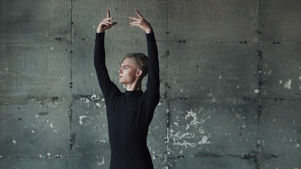 Portrait of a Male Ballet Dancer on a Dark Background