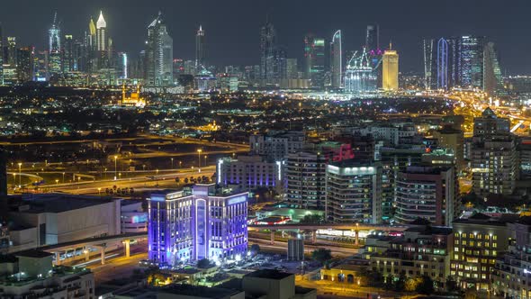 Modern View of Illuminated Buildings Appartments and Skyscrapers in Dubai Timelapse Aerial alt