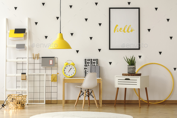 Bright kid play room interior with wooden furniture and black tr Stock Photo by bialasiewicz
