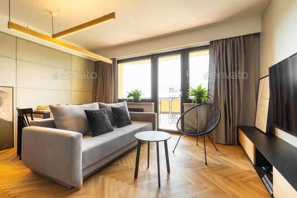 Urban style, cozy living room interior with industrial concrete Stock Photo by bialasiewicz