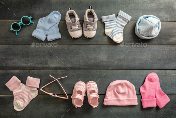 Baby boy and girl shoes and socks on 