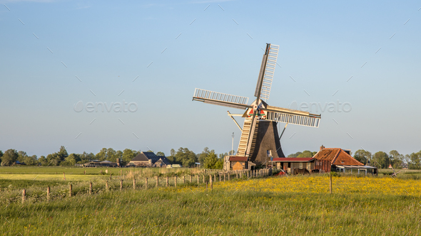 Wooden windmill on countryside - Stock Photo - Images