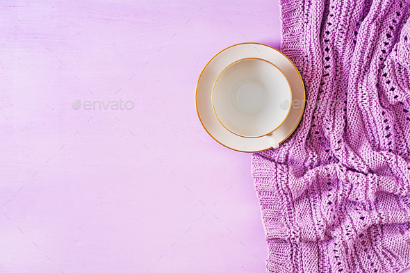 Empty white coffee cup on violet background, close up photo knitted sweater with mug - Stock Photo - Images