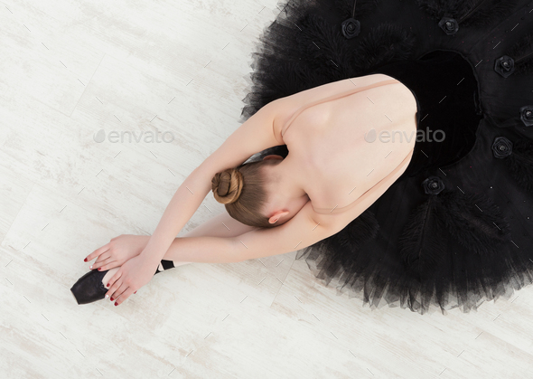 Graceful Ballerina stretching, ballet background, top view